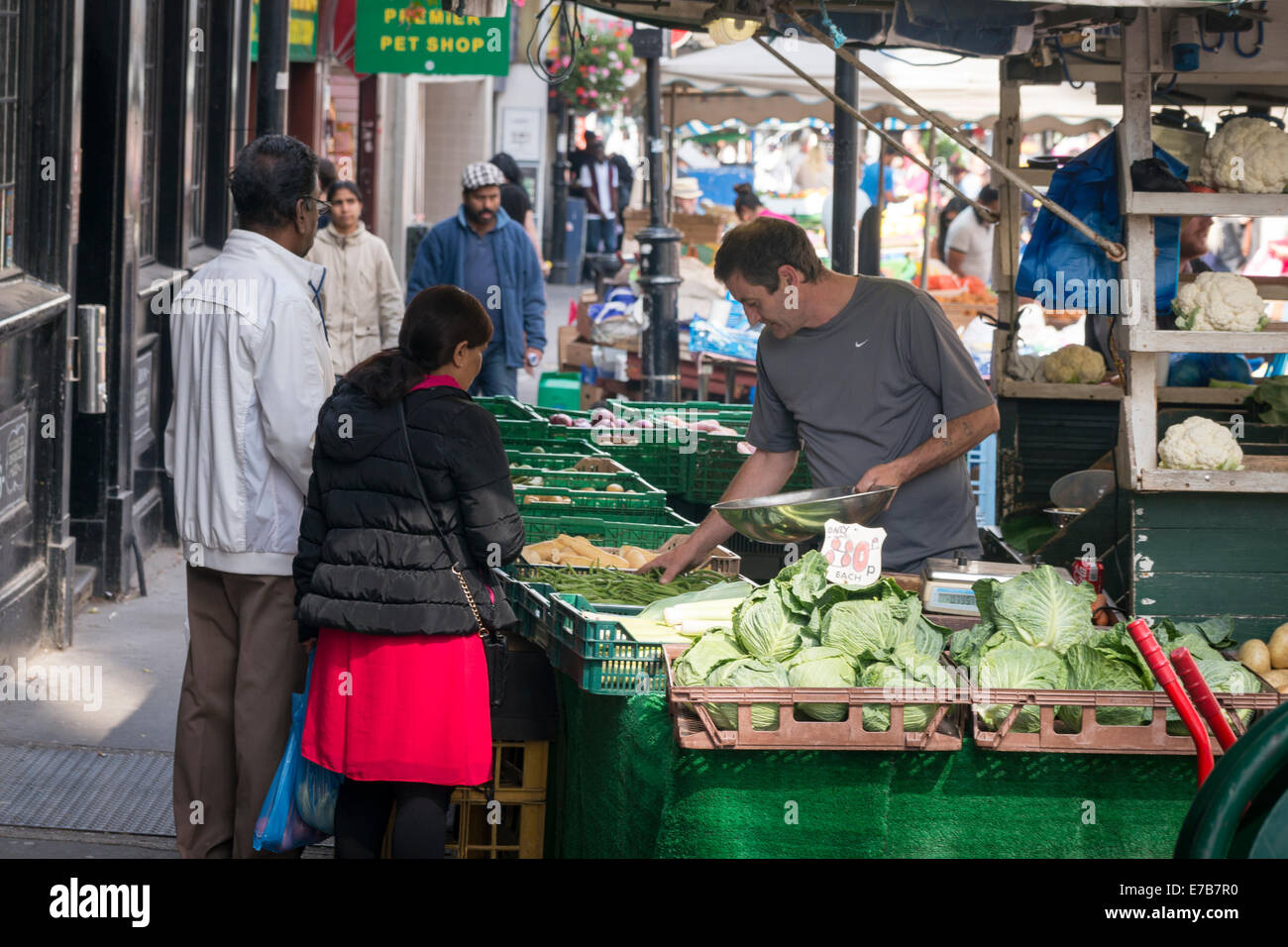 Market stall with customers Stock Photo