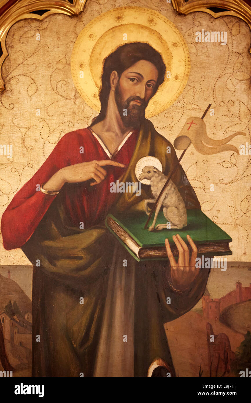 17th century painting in Jerez cathedral. Saint John the Baptist heralding the Coming of Christ, the lamb of God Stock Photo