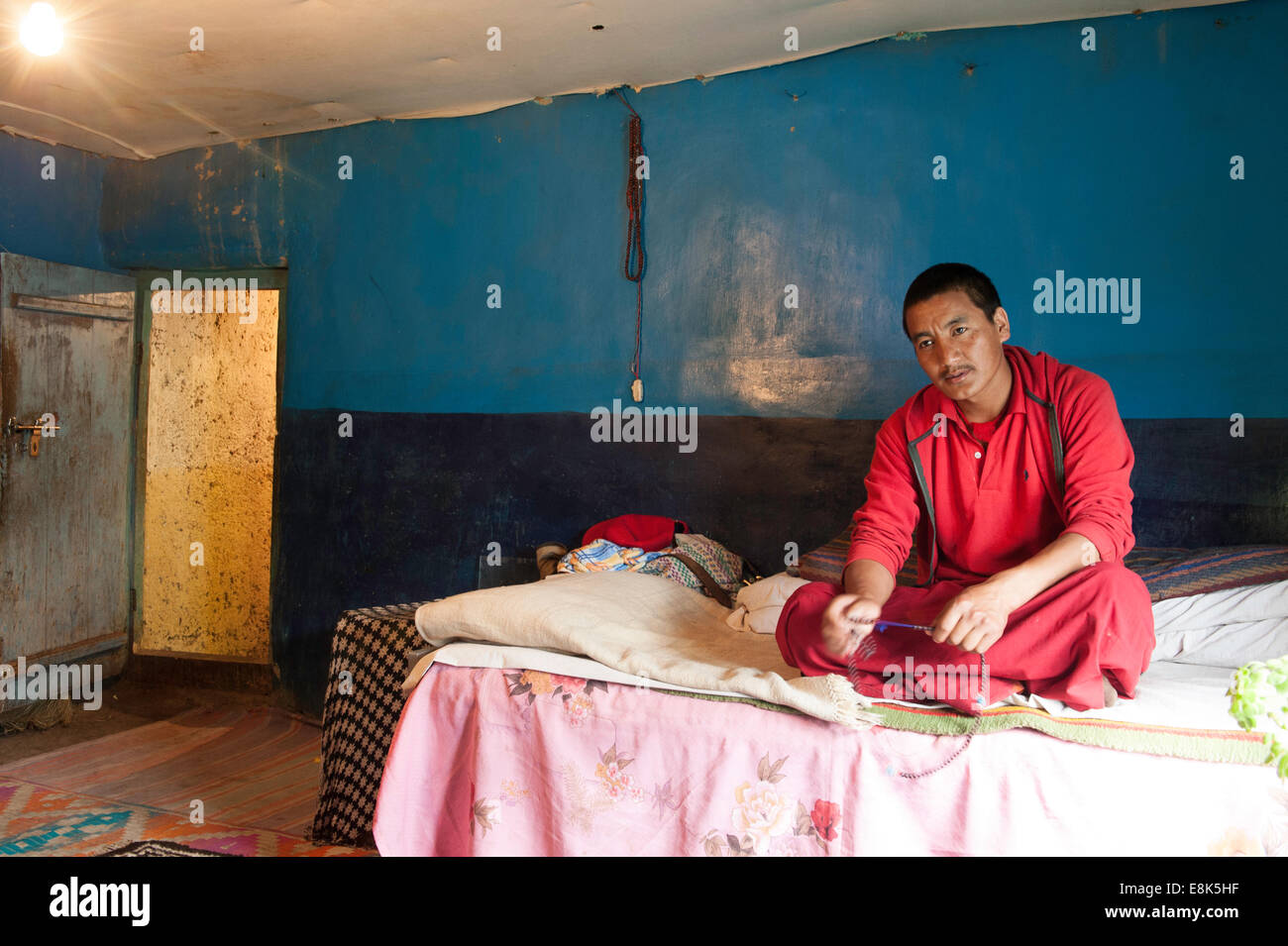 Monk chanting in his room at  Key monastery Stock Photo