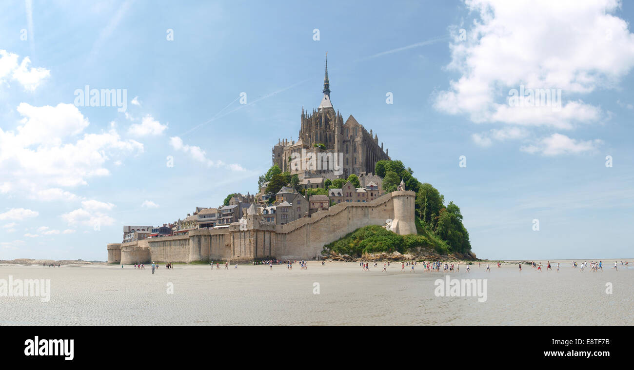 Mont St. Michel, France June 13, 2014: Abbey of Mont St. Michel. View of the Abbey from the sands at low tide. There are some un Stock Photo