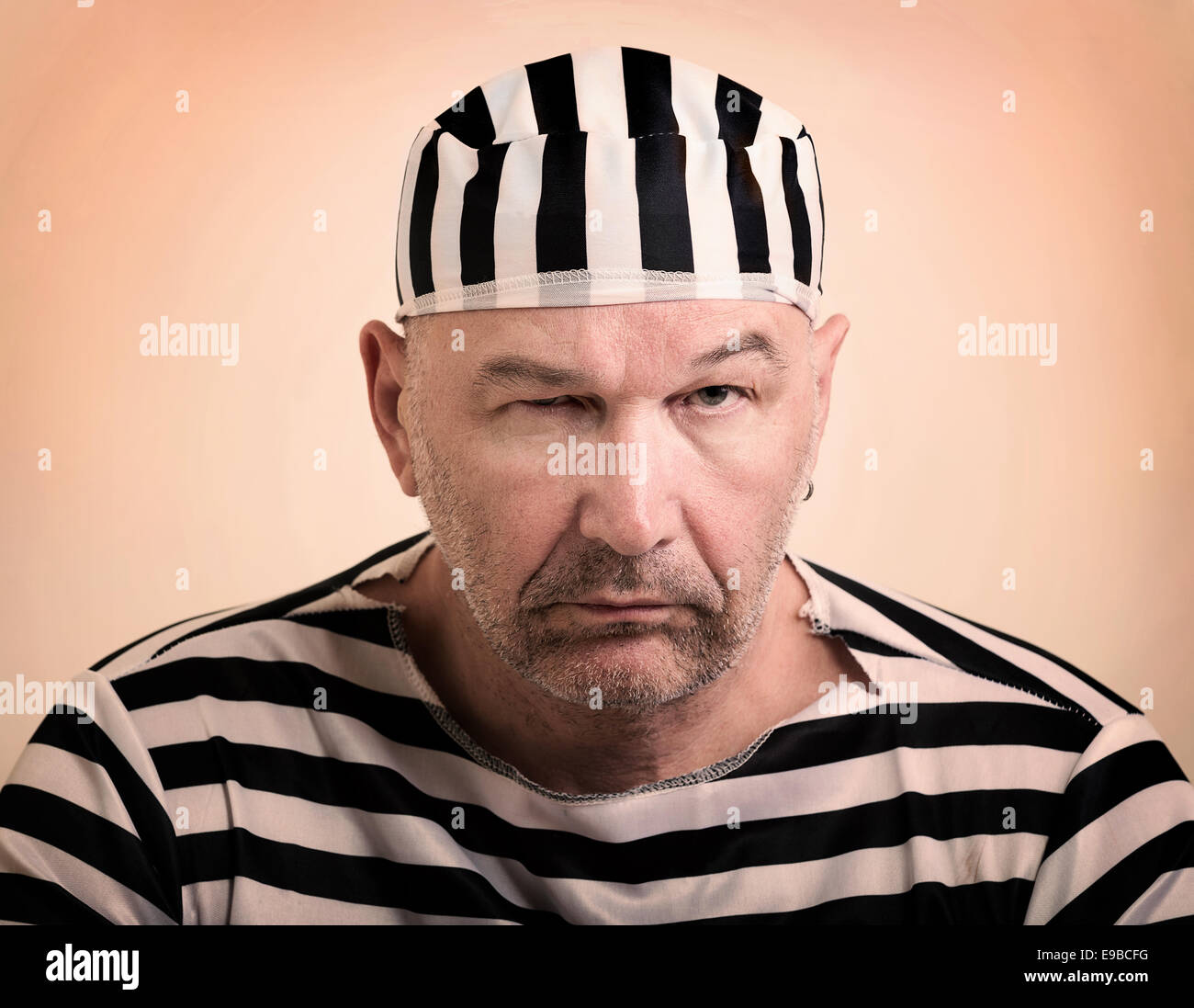 portrait of a man prisoner in prison garb Stock Photo