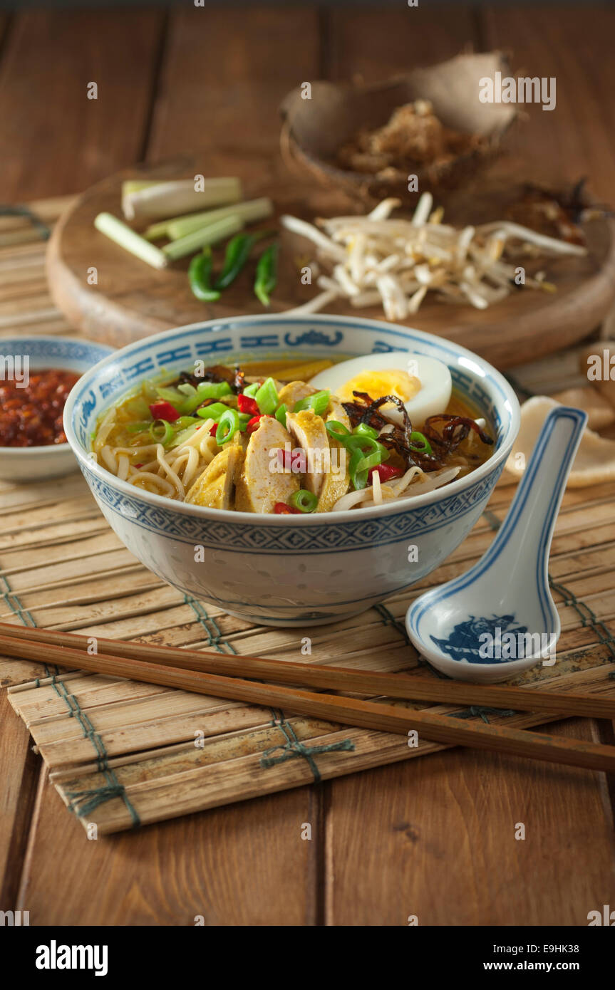 Soto ayam. Chicken and noodle soup. Indonesia Food Stock Photo