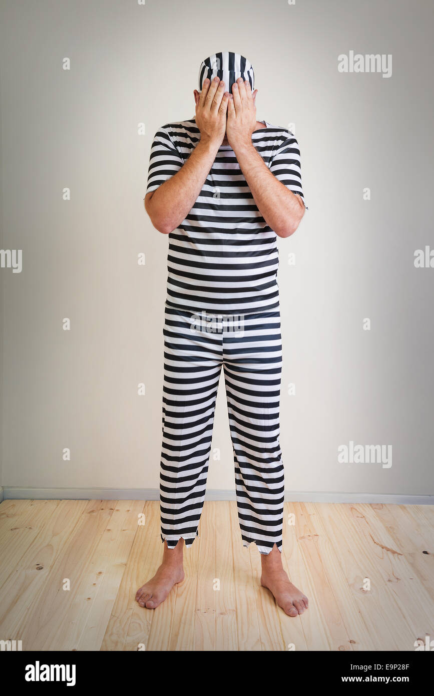 portrait of a man prisoner in prison garb Stock Photo