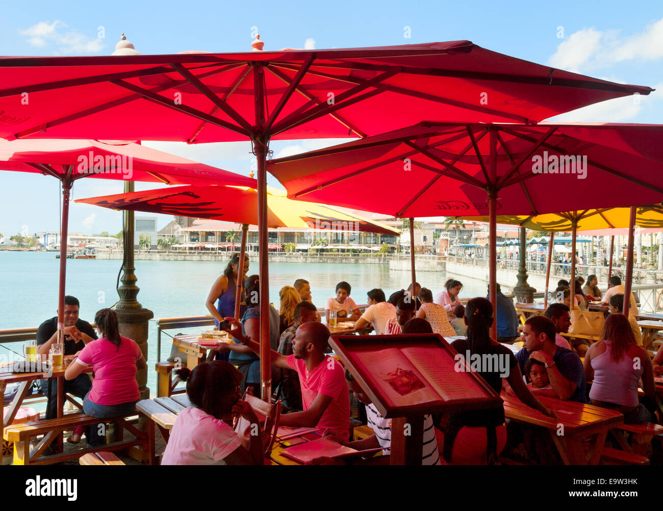 People sitting at a cafe in the  Caudan Waterfront, Port Louis, Mauritius Stock Photo