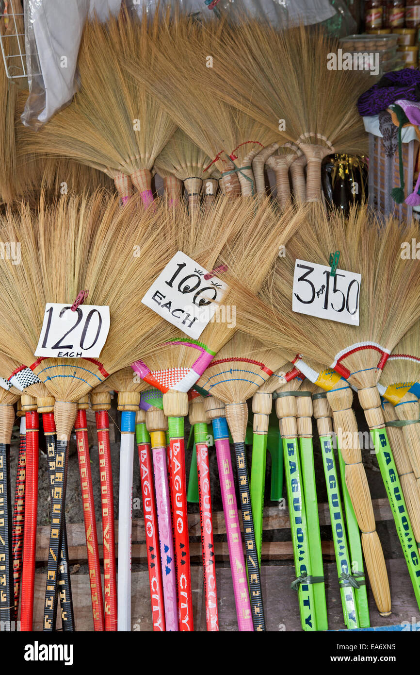 Handmade souvenir straw brooms for sale at a roadside stand in Baguio City, Luzon Island, Philippines. Stock Photo