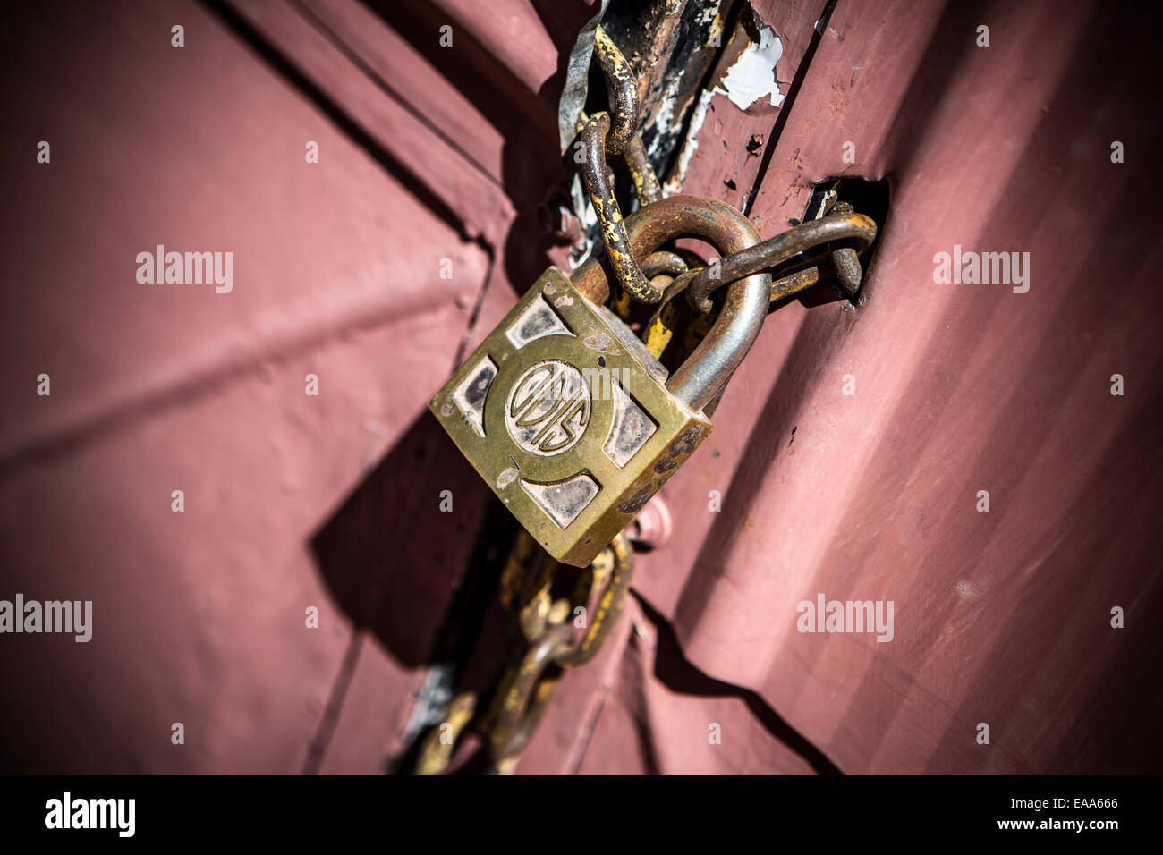 Metal doors held shut with a chain and padlock. Stock Photo