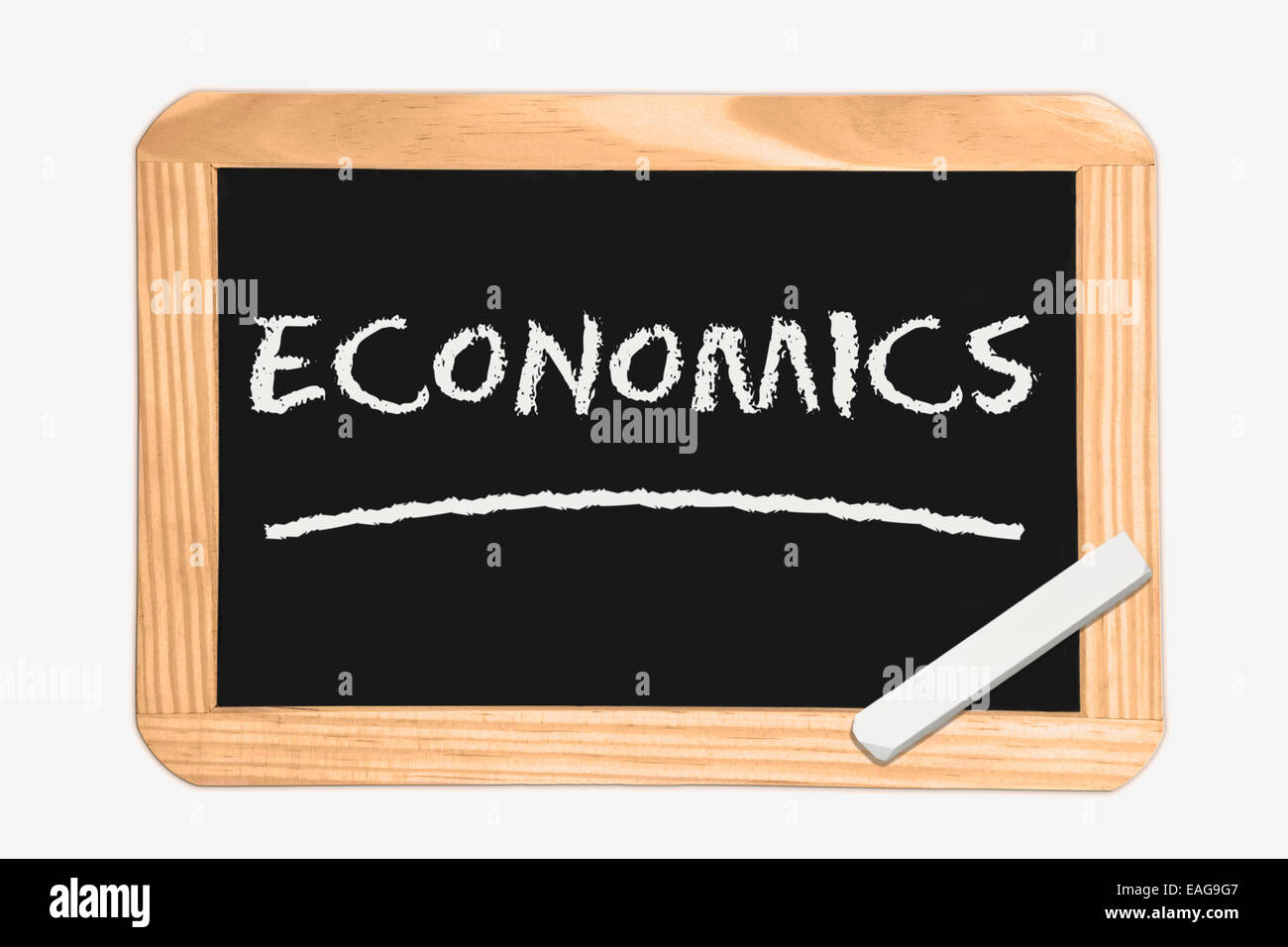 Blackboard with the inscription Economics, a piece of white chalk in the corner Stock Photo