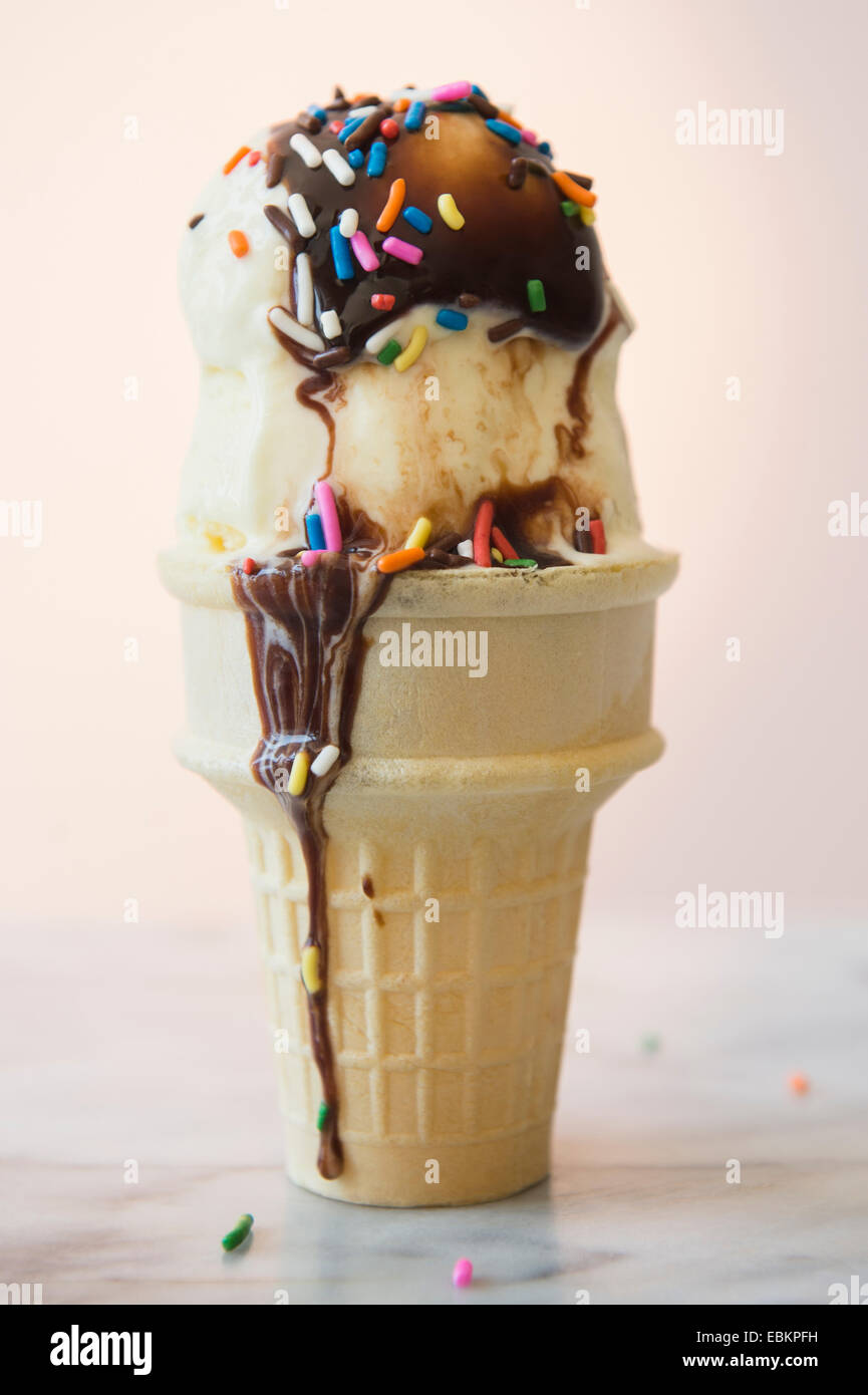 Studio shot of ice cream cone with chocolate sauce Stock Photo