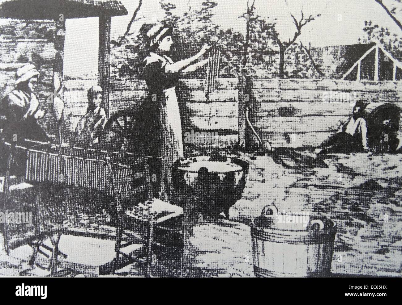 Engraving of a housewife making candles in a colonial home. Dated 17th century. Stock Photo