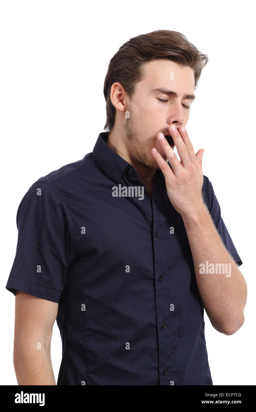 Tired man covering his mouth white yawning isolated on a white background Stock Photo