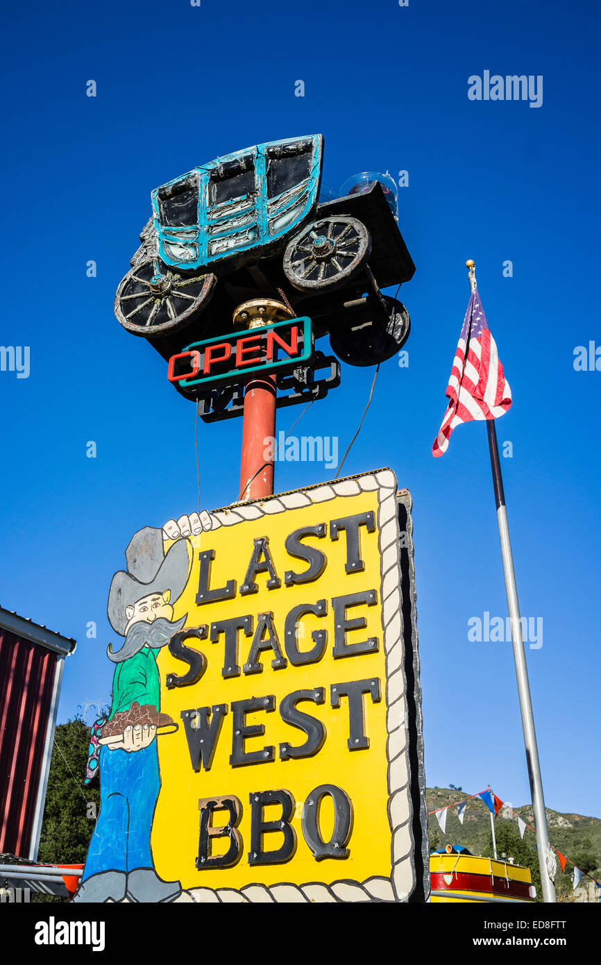 A bizarre BBQ sign with stage coach and cowboy on highway 41, Atascadero, CA. Stock Photo