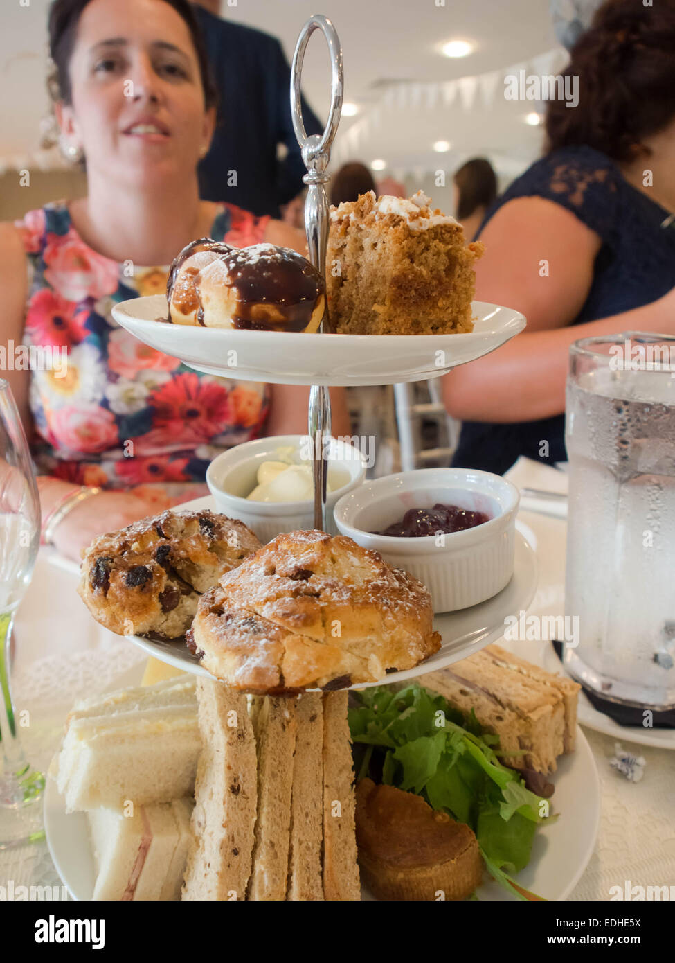 A lady is served afternoon tea Stock Photo