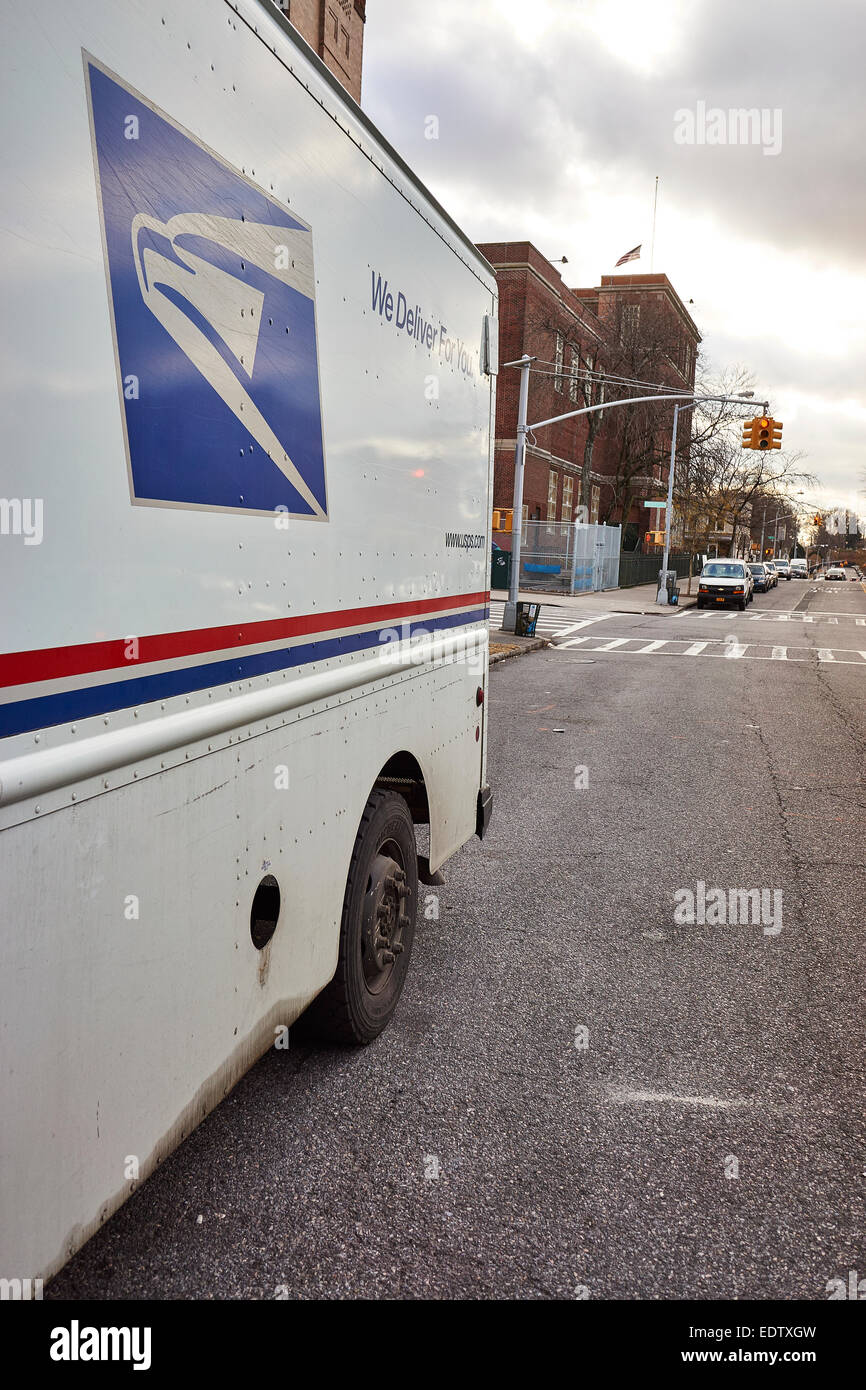 US Postal service truck delivering parcels in Brooklyn, NY Stock Photo