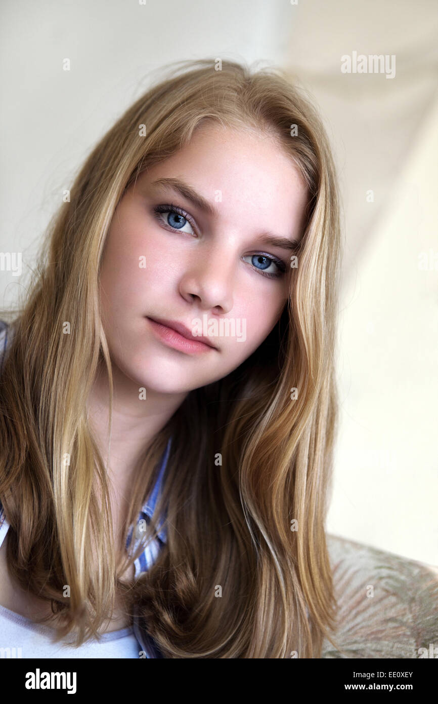 Portrait of a young teenage woman looking into the camera with a serious expression on her face. Stock Photo