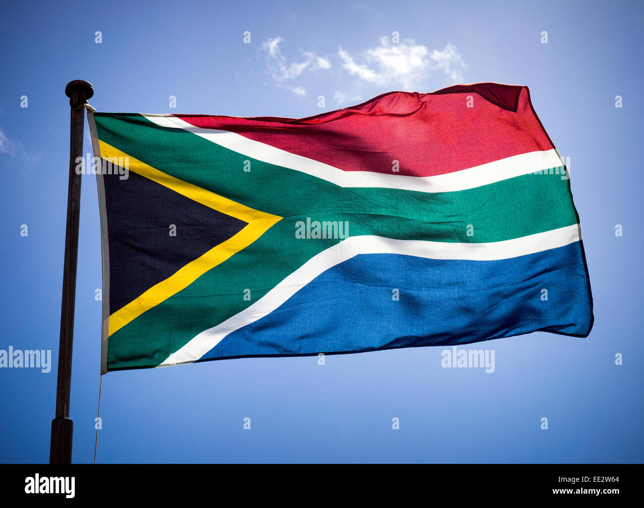 The modern South African national flag, in use since 1994, flying on a flagpole in Cape Town, South Africa. Stock Photo