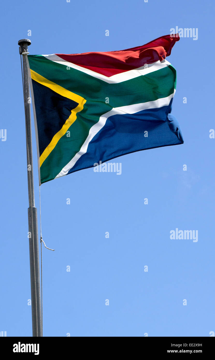 The modern South African national flag, in use since 1994, flying on a flagpole in Cape Town, South Africa. Stock Photo