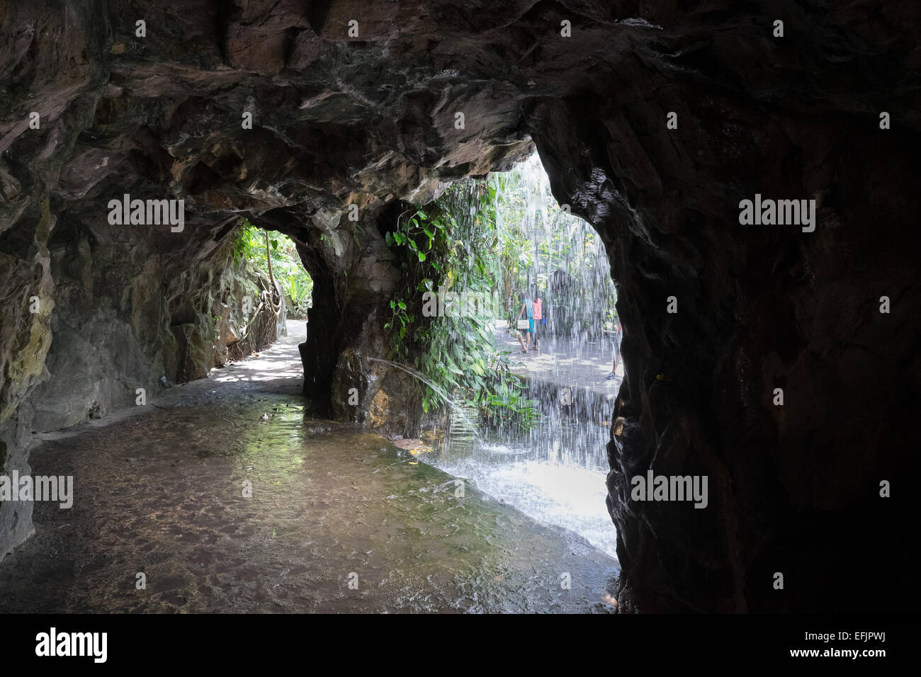 Singapore Botanic Gardens. Man made waterfall and cave. Stock Photo