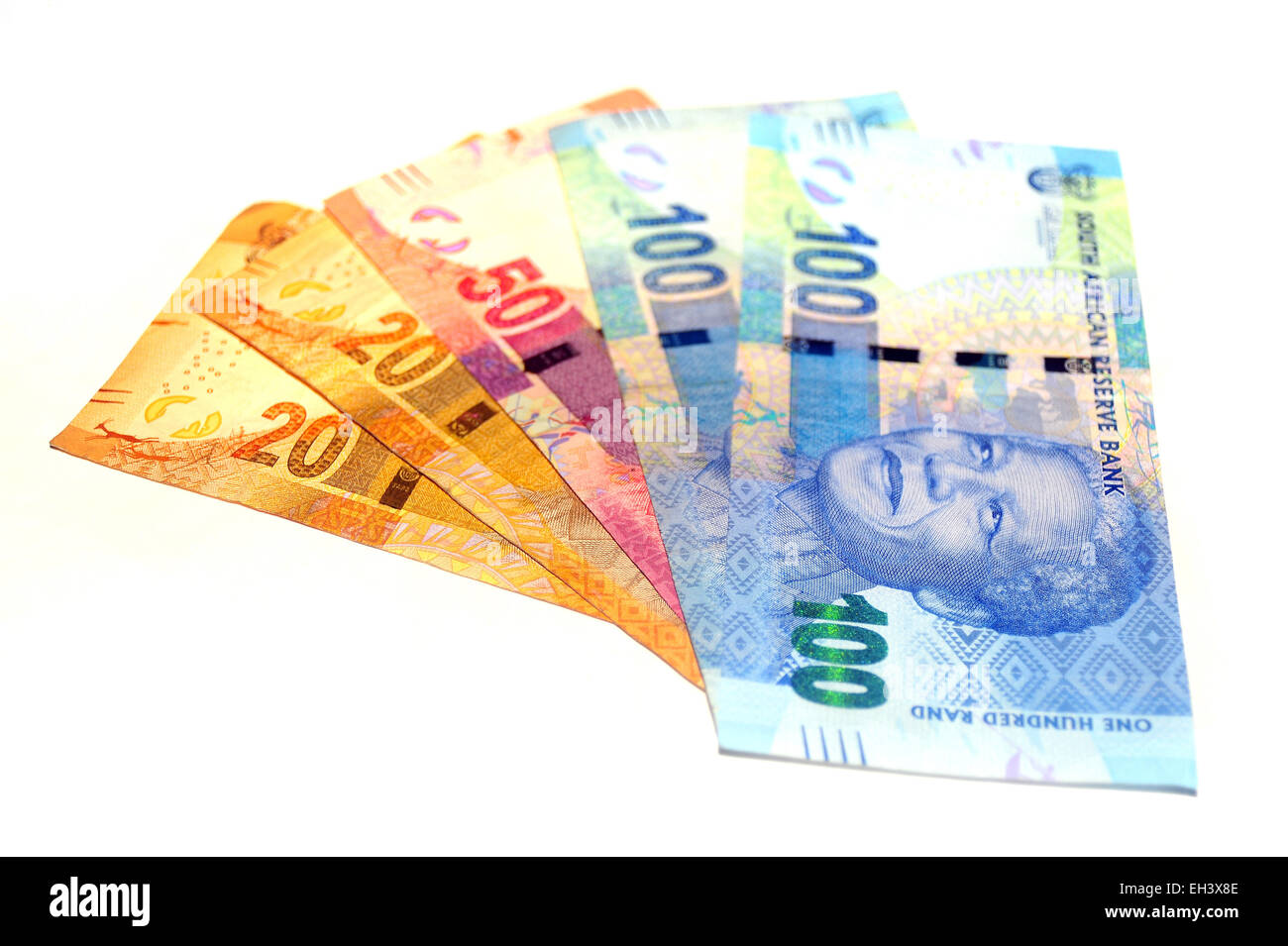 South African Rand notes featuring the face of Nelson Mandela photographed against a white background. Stock Photo