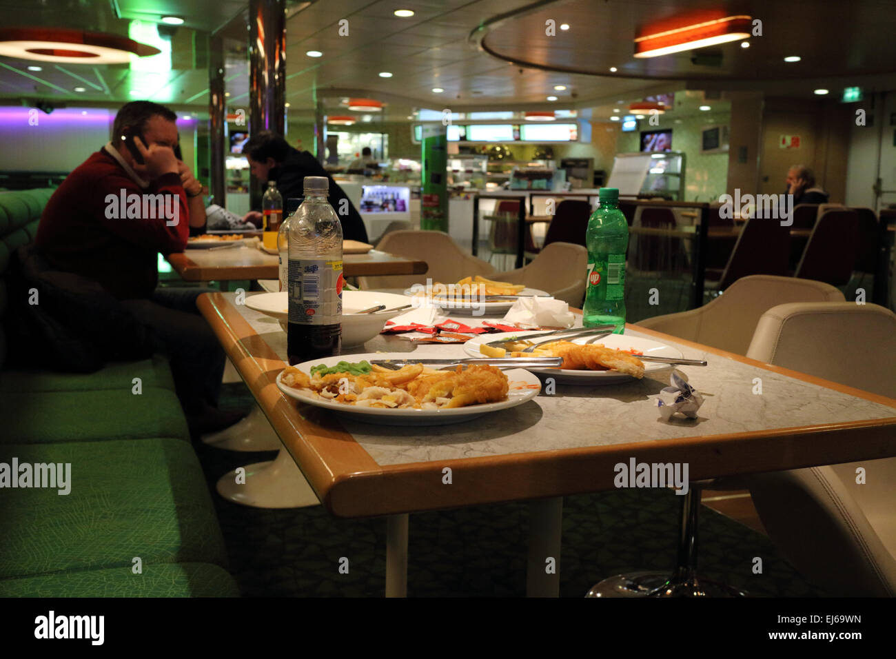 half eaten fish and chips meals in a ferry restaurant in the uk Stock Photo