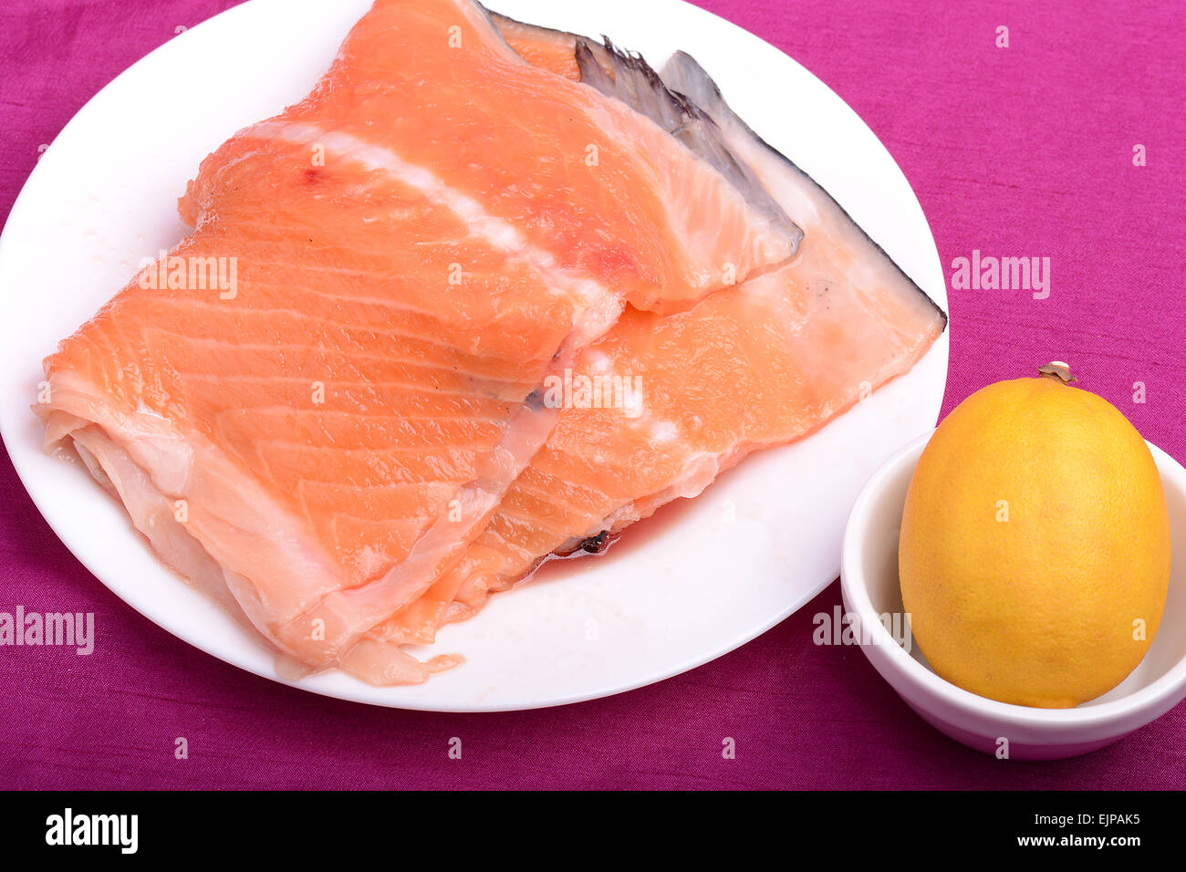 Slice of red fish salmon with fruits Stock Photo