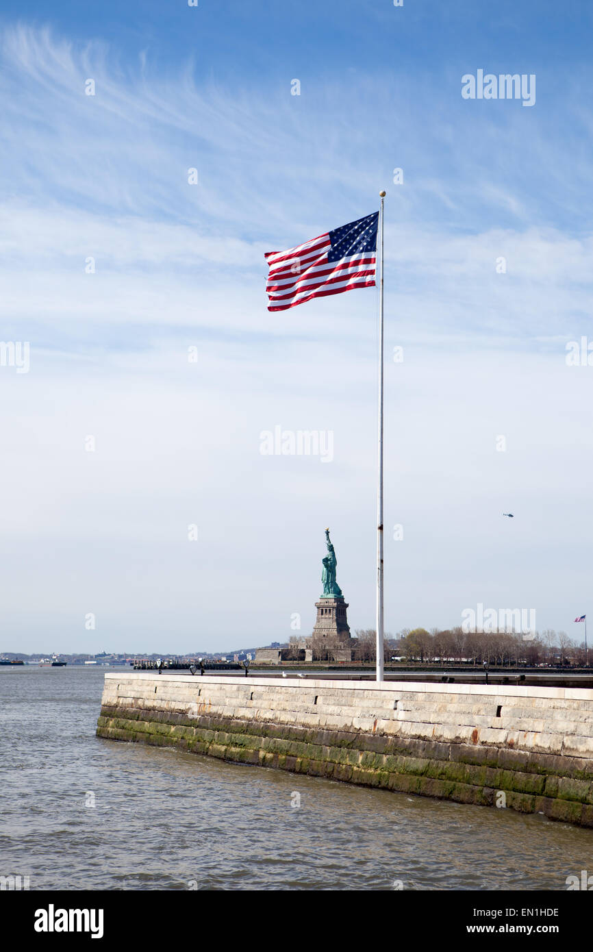 American flag and Statue of Liberty Stock Photo