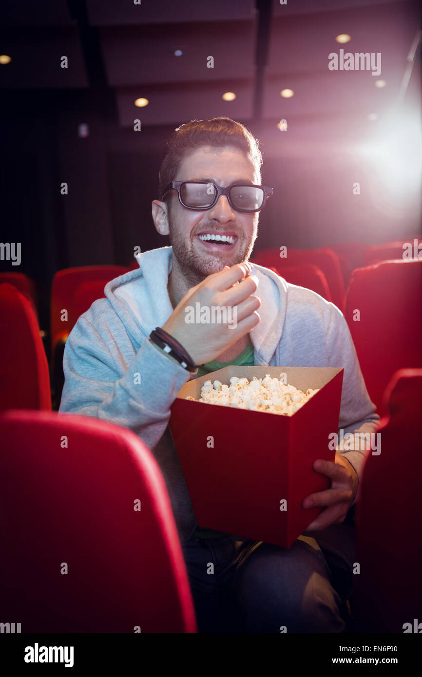 Young man watching a 3d film Stock Photo