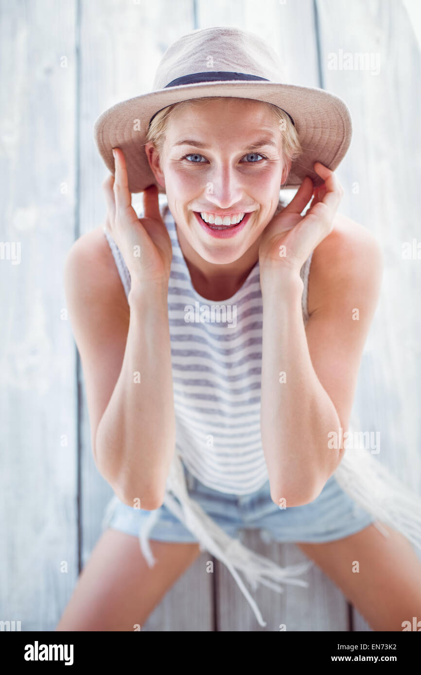 Pretty blonde woman wearing hat and smiling at camera Stock Photo