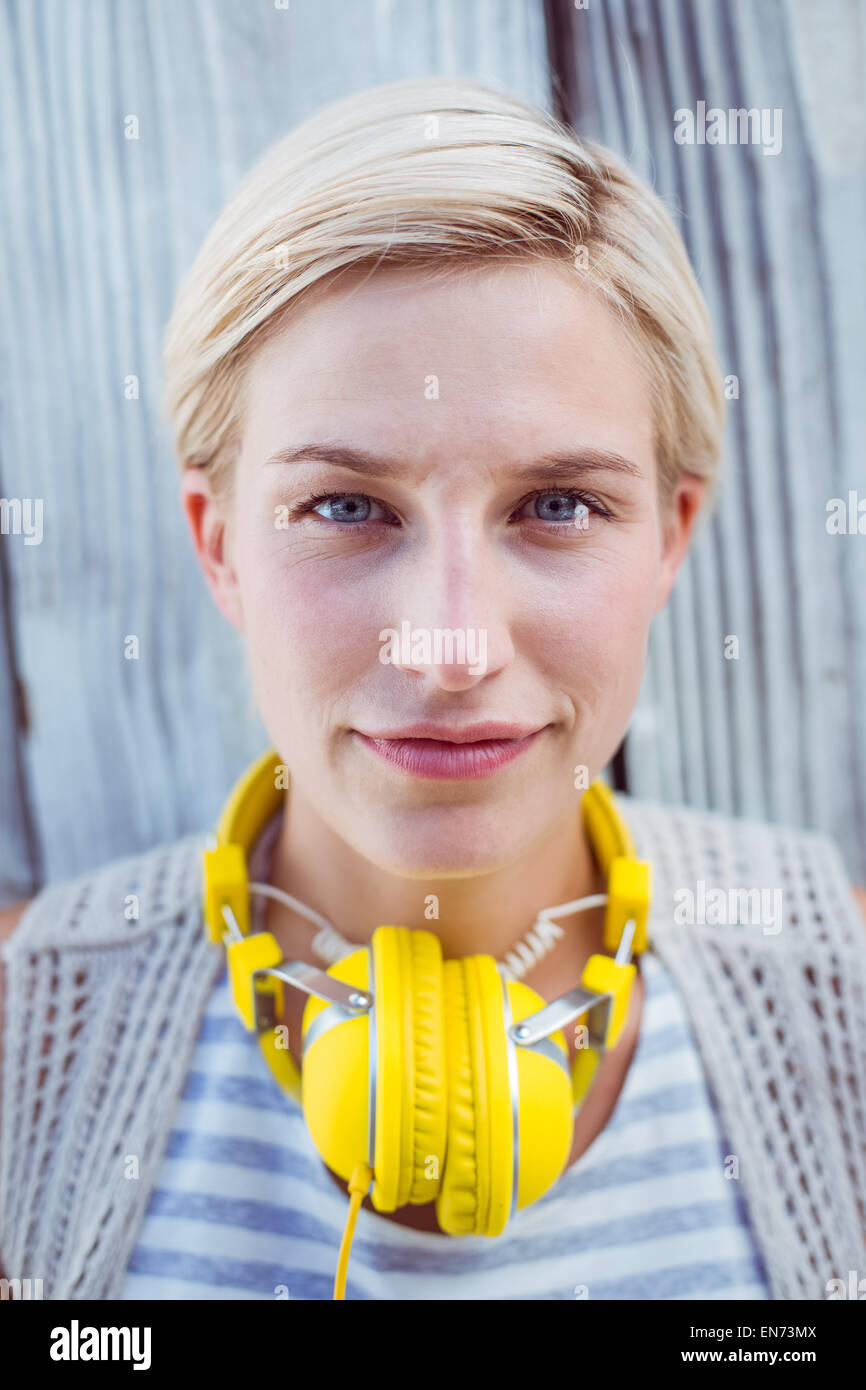 Pretty blonde woman wearing yellow headset Stock Photo