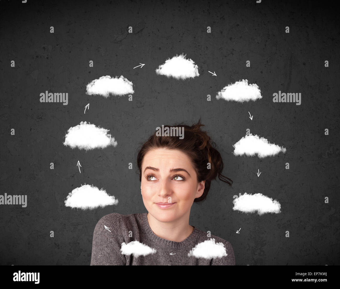 Young woman thinking with cloud circulation around her head Stock Photo