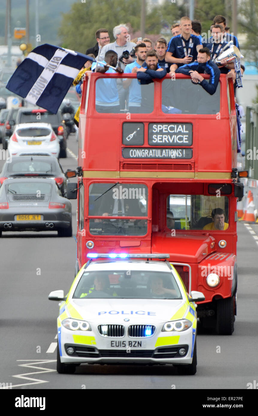 Southend United celebrated promotion to League One with an open top bus parade through the town and along the seafront. Police escort Stock Photo