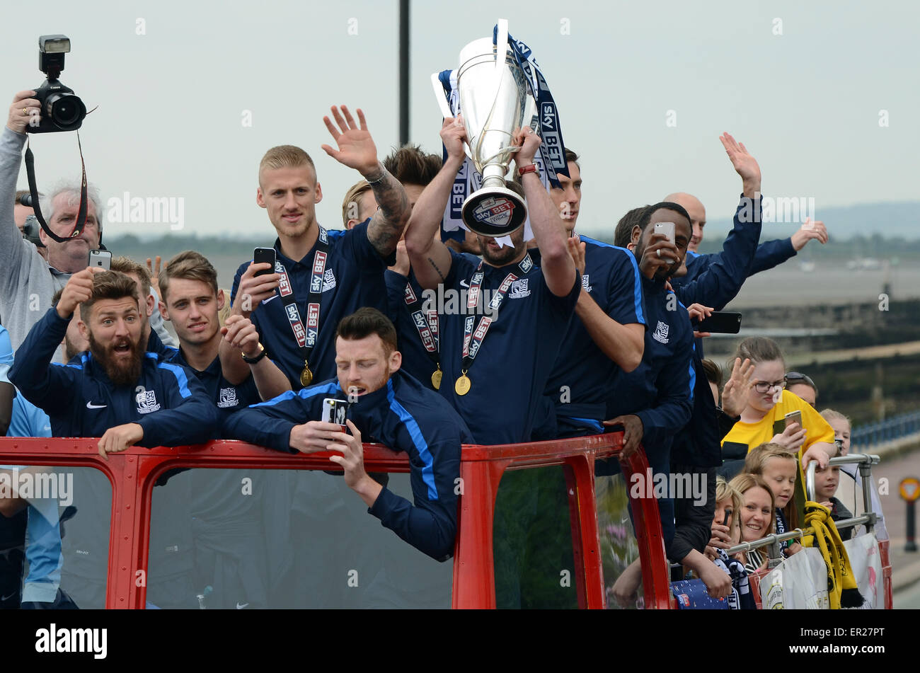 Southend United celebrated promotion to League One with an open top bus parade through the town and along the seafront. Players with winners trophy Stock Photo