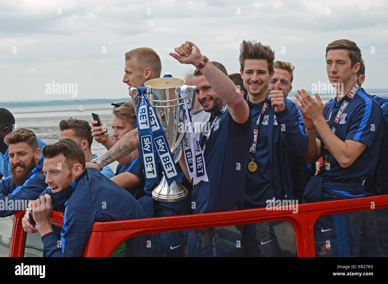 Southend United celebrated promotion to League One with an open top bus parade through the town and along the seafront. Players with cup trophy Stock Photo