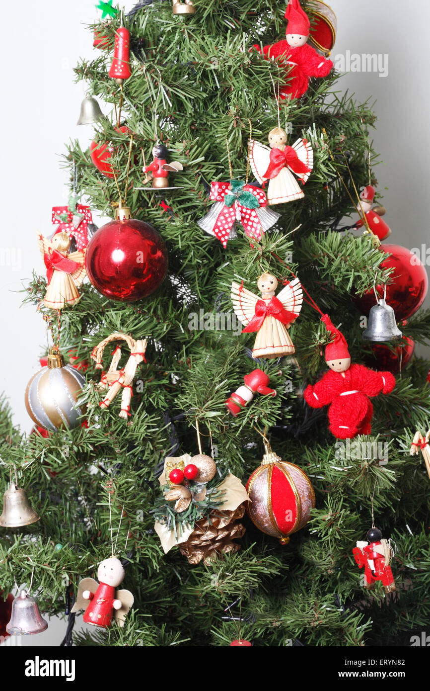 Christmas tree decorated with balls and miniature dolls in Christmas festival Stock Photo