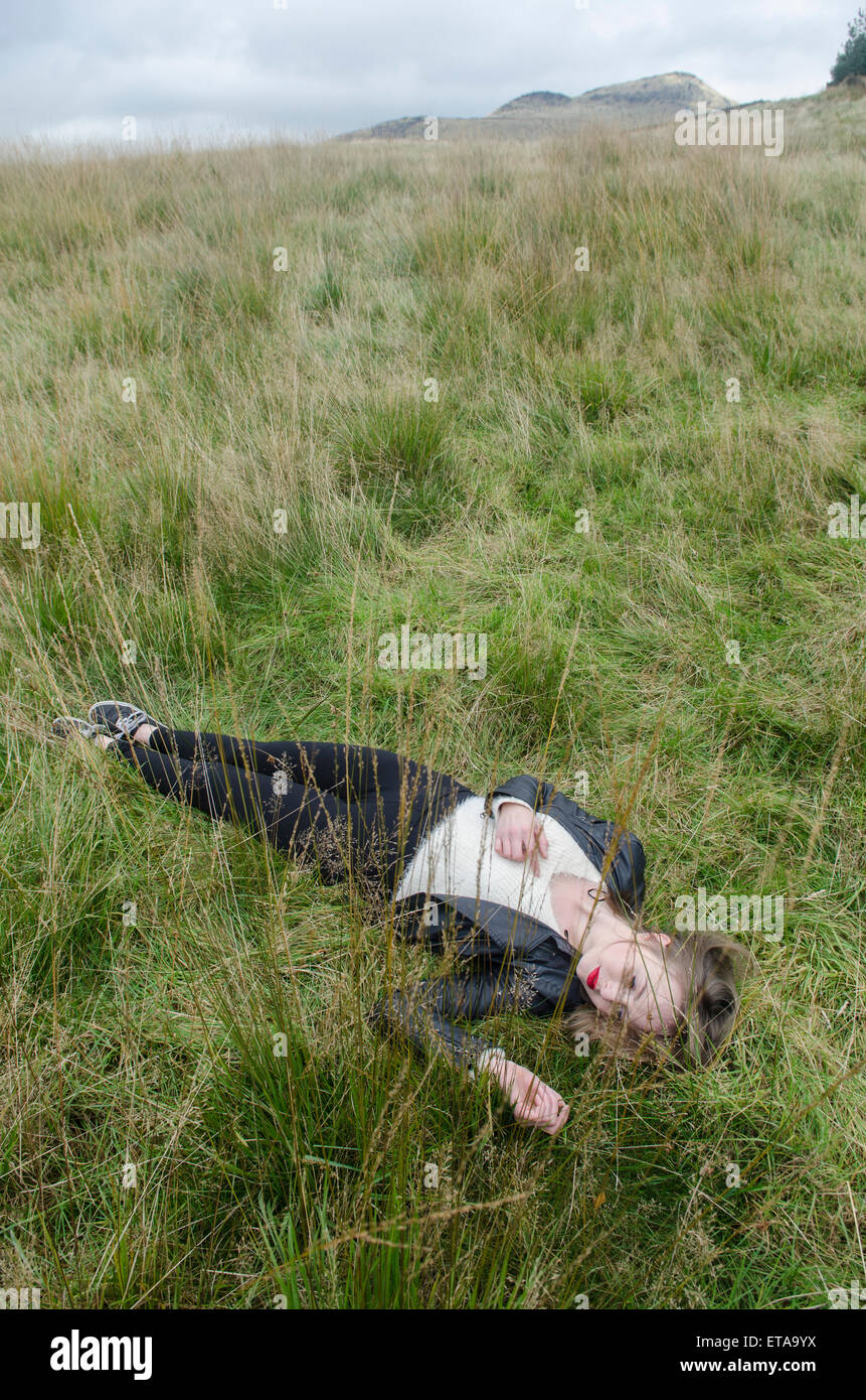 Dead woman in the field Stock Photo