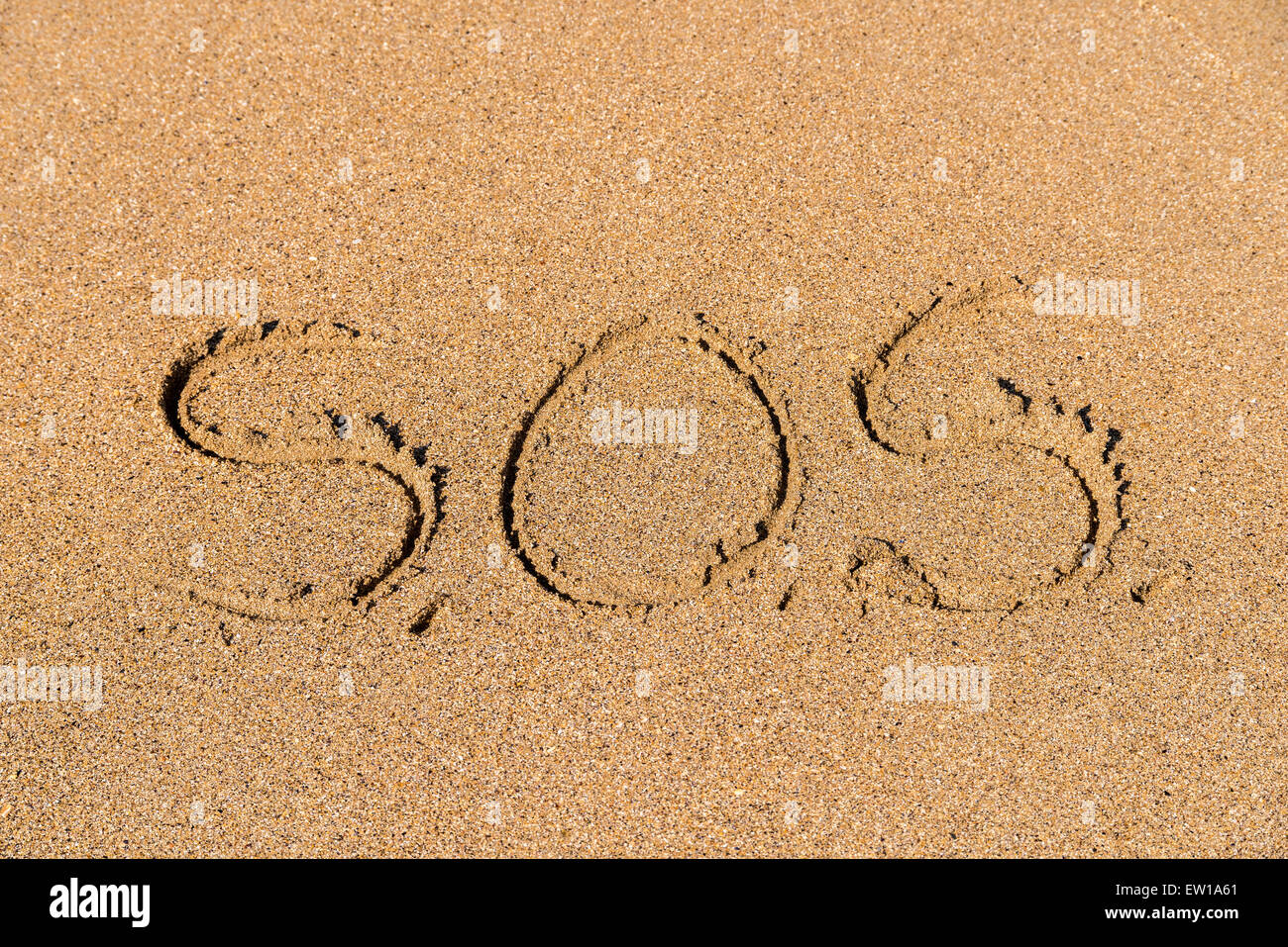 Help Sign Drawn On Beach Sand Stock Photo