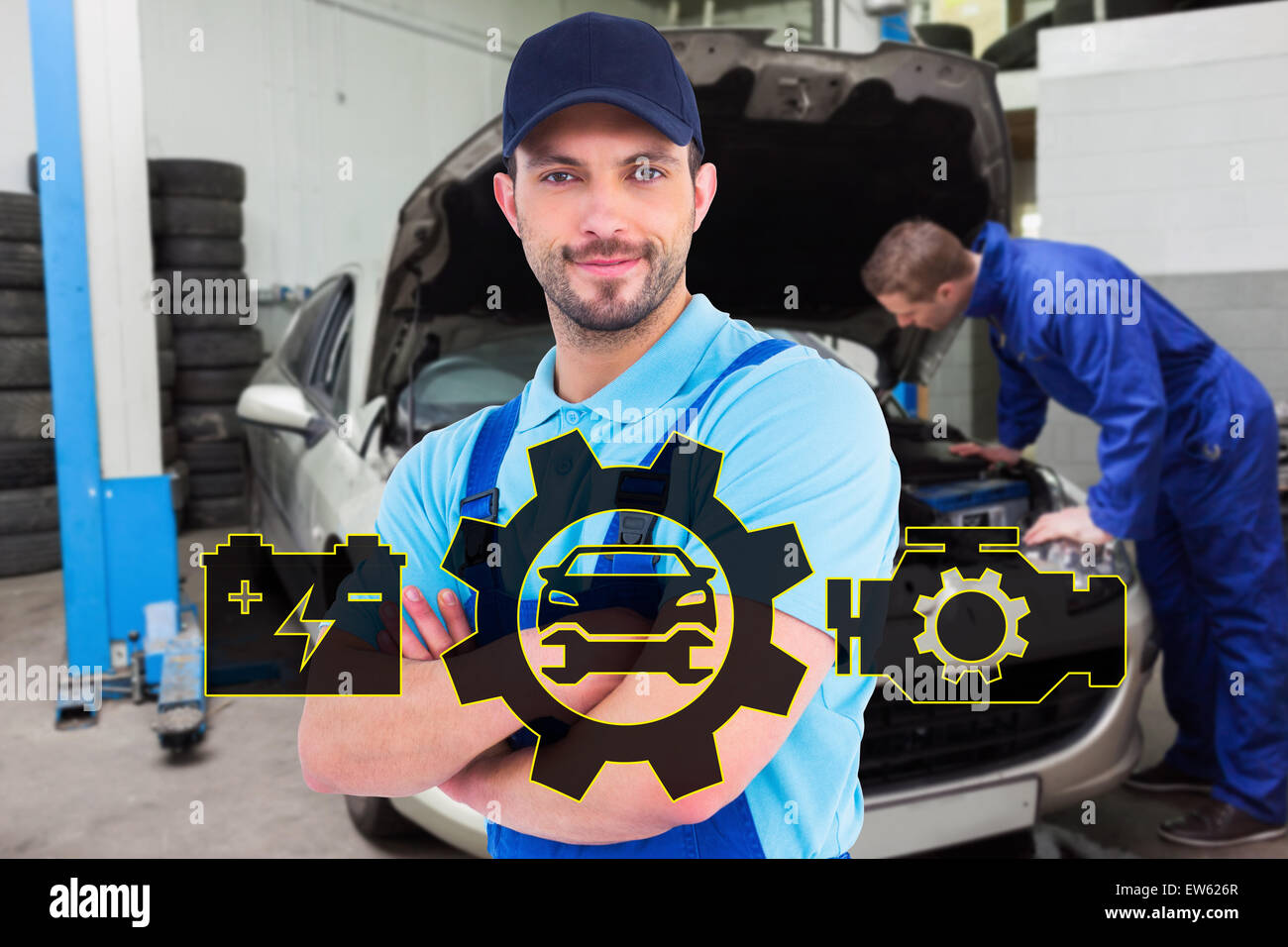 Composite image of smiling male handyman in coveralls standing arms crossed Stock Photo