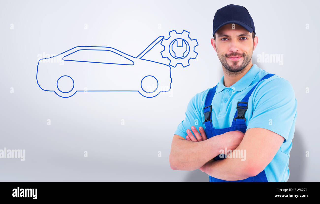 Composite image of smiling male handyman in coveralls standing arms crossed Stock Photo