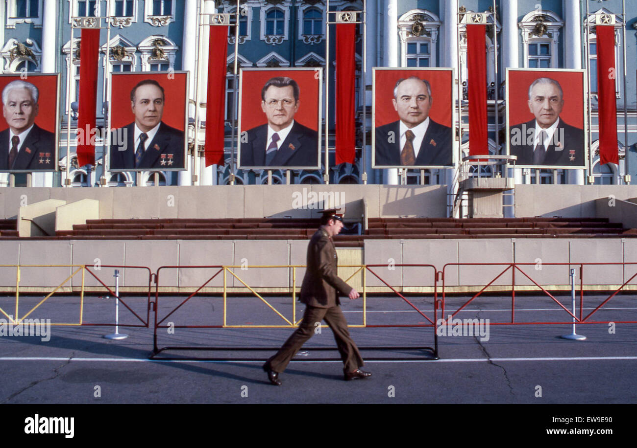 April 30, 1984 - Leningrad, Russia - A Soviet soldier walks by the Winter Palace, part of the Hermitage Museum, in the Palace Square, the central city square of Leningrad (St. Petersburg), decorated for the annual May Day Parade with reviewing stands and portraits of the Central Committee of the Communist Party of the USSR. At left is Konstantin Chernenko the fifth General Secretary of the Communist Party who led the USSR from February 1984 until his death in March 1985. Second from right is Mikhail Gorbachev who was eighth and last leader of the USSR. (Credit Image: © Arnold Drapkin/ZUMA Wire Stock Photo