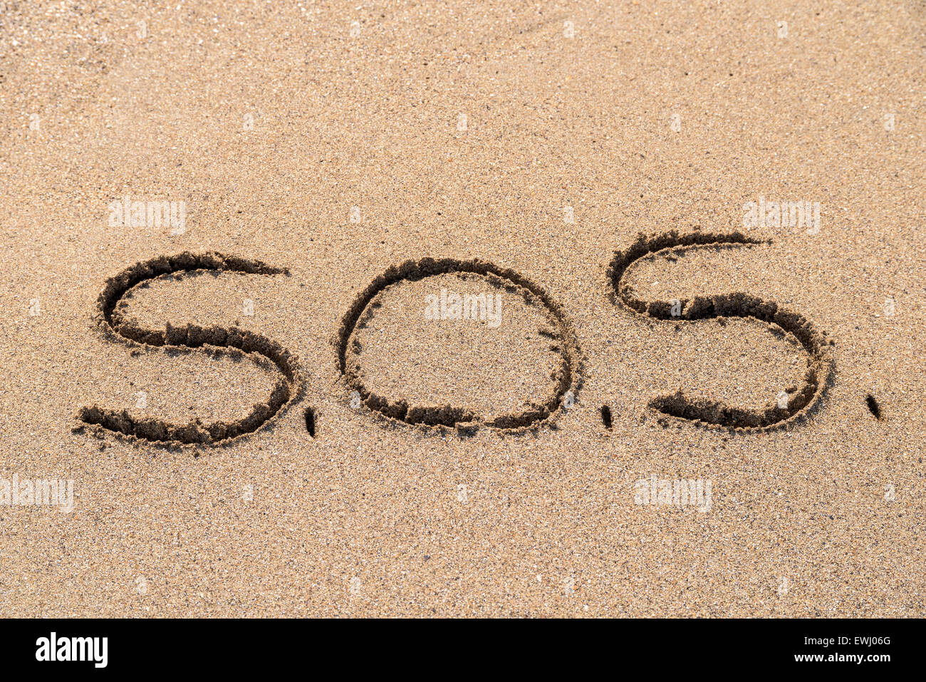 Save Me Sign Drawn On Beach Sand Stock Photo