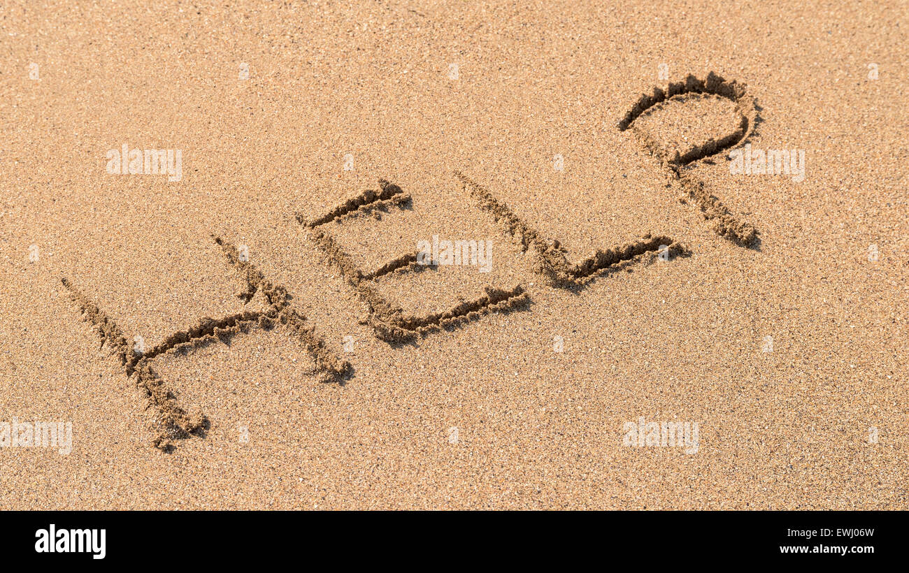 Save Me Sign Drawn On Beach Sand Stock Photo