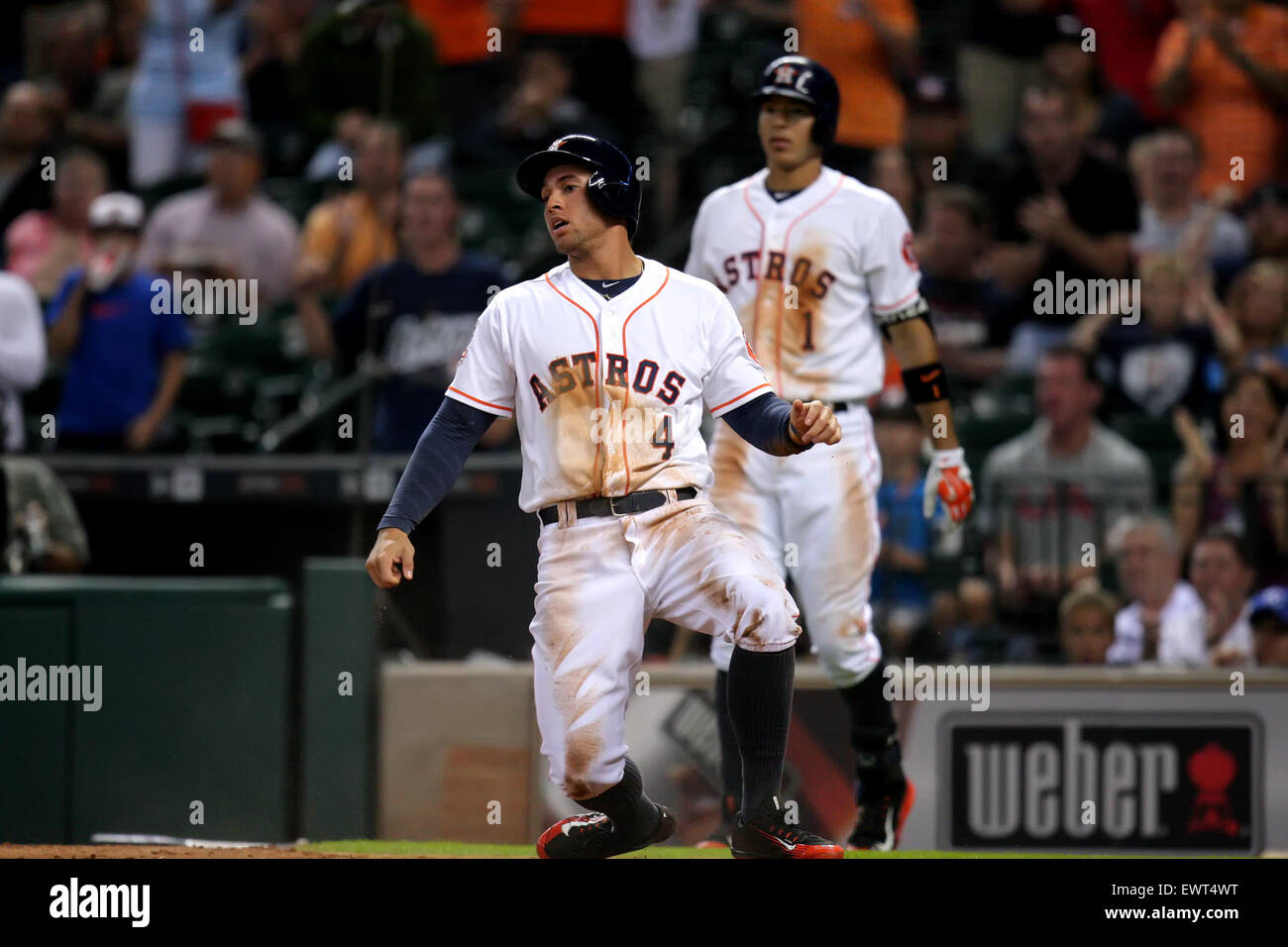 Houston, TX, USA. 30th June, 2015. Houston Astros right fielder George Springer #4 picks himself up after sliding head-first into home to score a run during the MLB baseball game between the Houston Astros and the Kansas City Royals from Minute Maid Park in Houston, TX. (Mandatory credit: Erik Williams/CSM) Credit:  csm/Alamy Live News Stock Photo