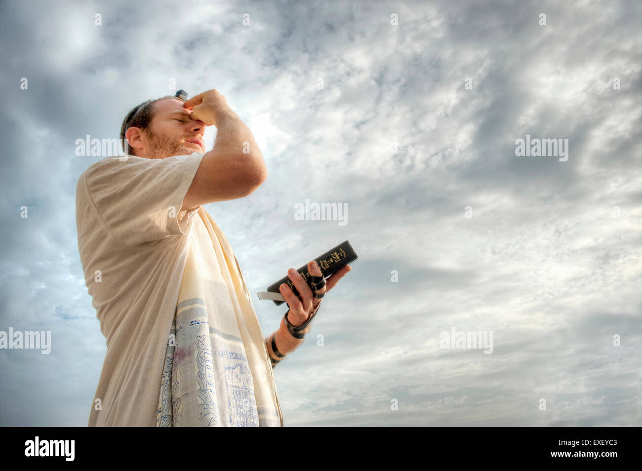 Jewish man engaged in morning prayers. Stock Photo