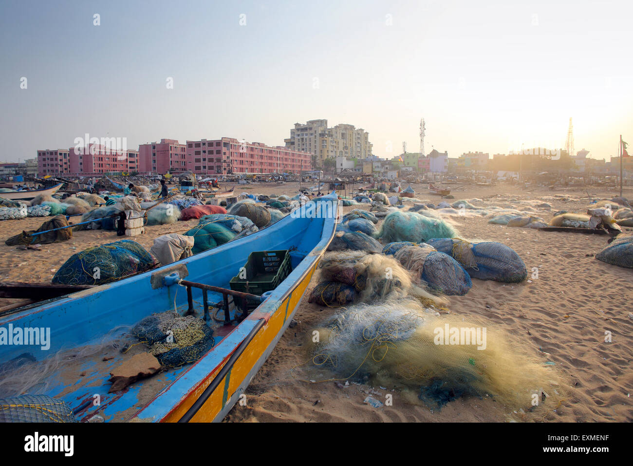 Wooden fishing boats and nets on the beach in Chennai, India Stock Photo