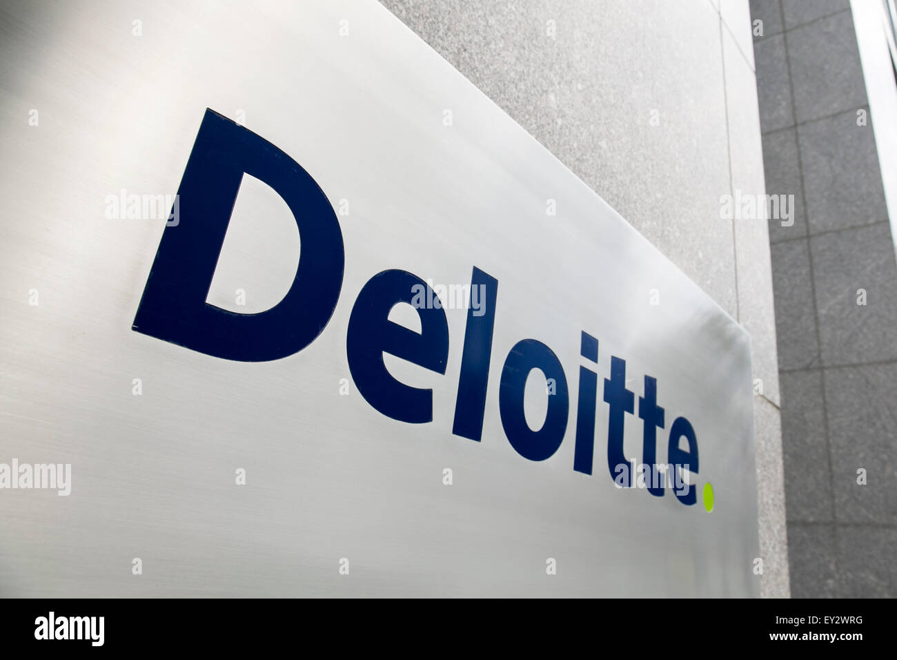 A logo sign outside of an office building occupied by Deloitte Touche Tohmatsu Limited in Arlington, Virginia on July 12, 2015. Stock Photo