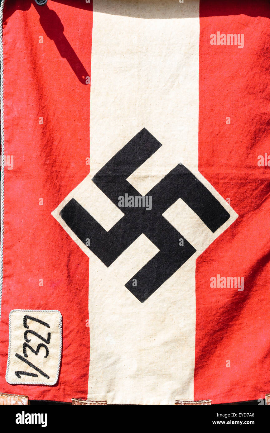 Nazi German army regimental flag. Two red horizontal strips with white band in middle and swastika. 1/327 in top corner. Stock Photo