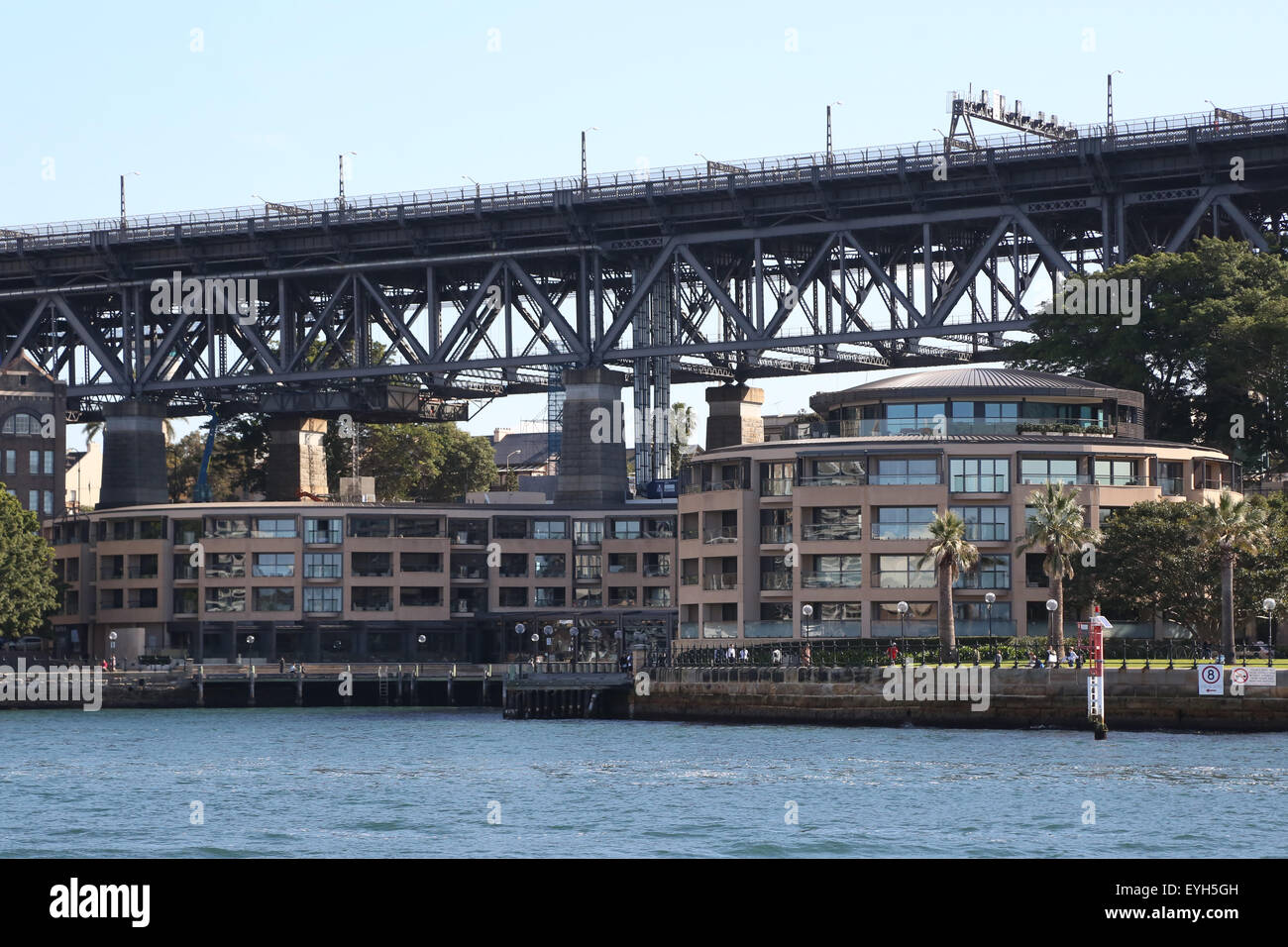 The Park Hyatt Sydney viewed from Sydney Harbour, with the Sydney Harbour Bridge in the background. Stock Photo