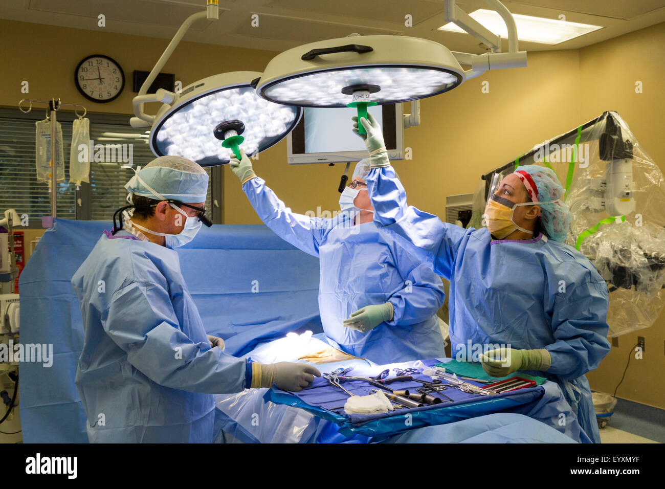 Englewood, Colorado - Dr. Paul Elliott (left) and his surgical team prepares to perform lumbar spine surgery. Stock Photo