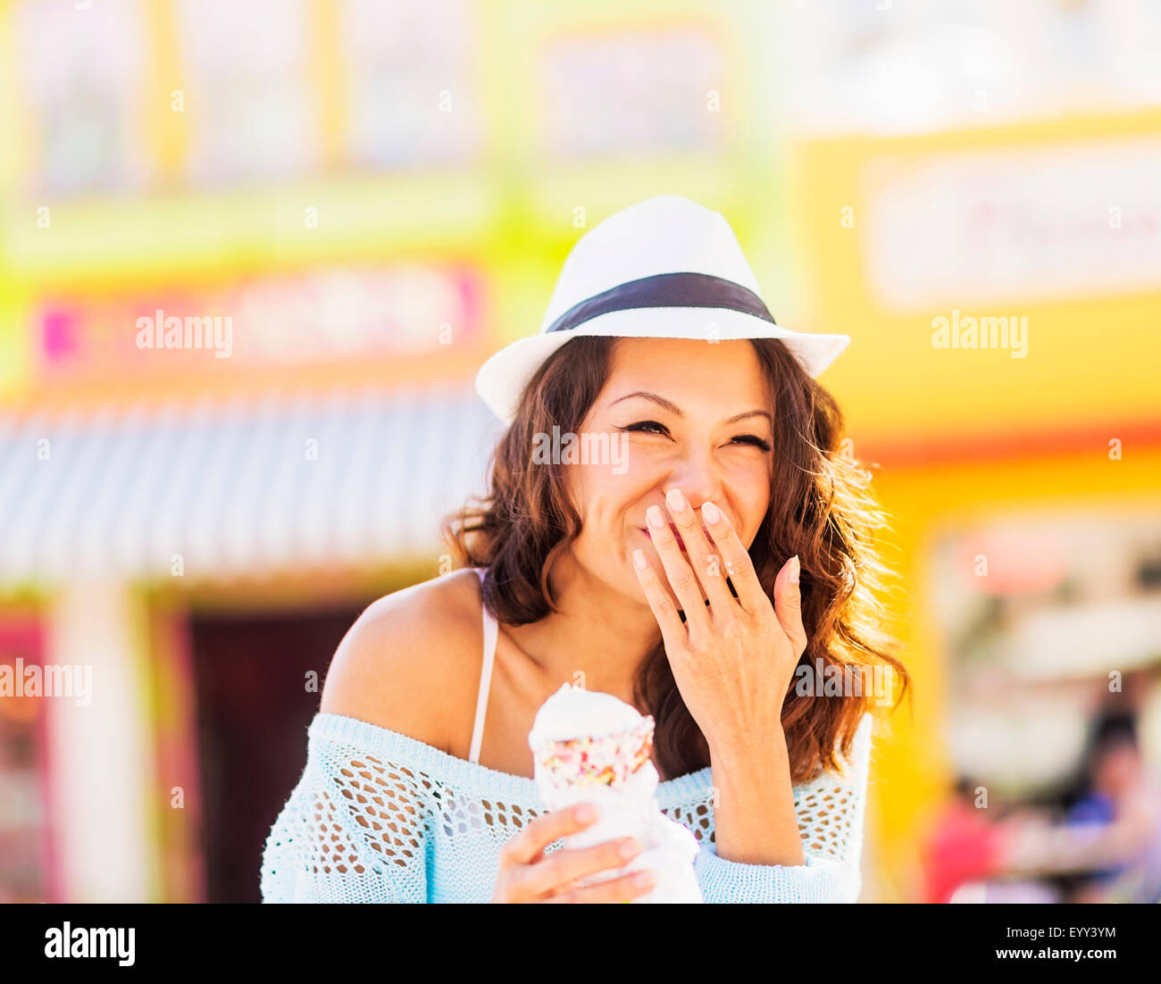 Chinese woman eating ice cream cone Stock Photo