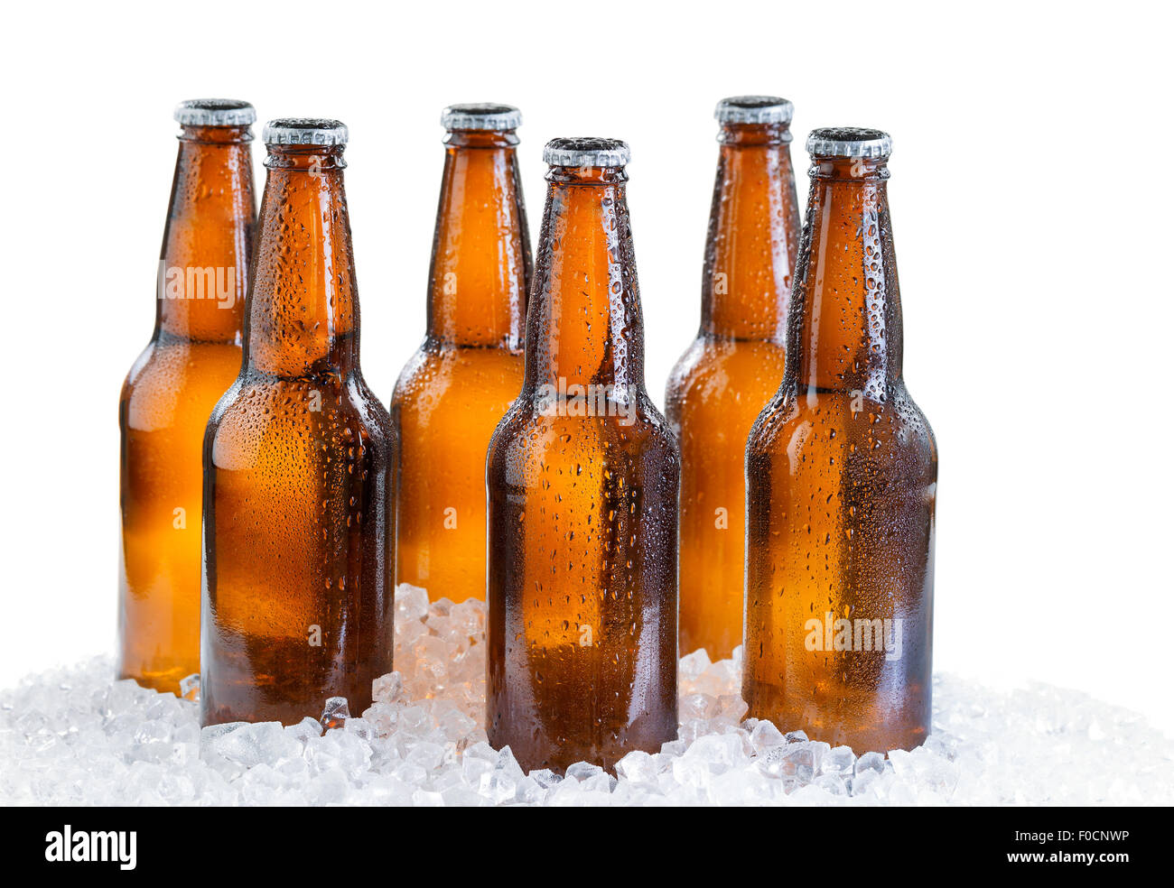 Six pack of bottled beer with drops and ice isolated on white background Stock Photo