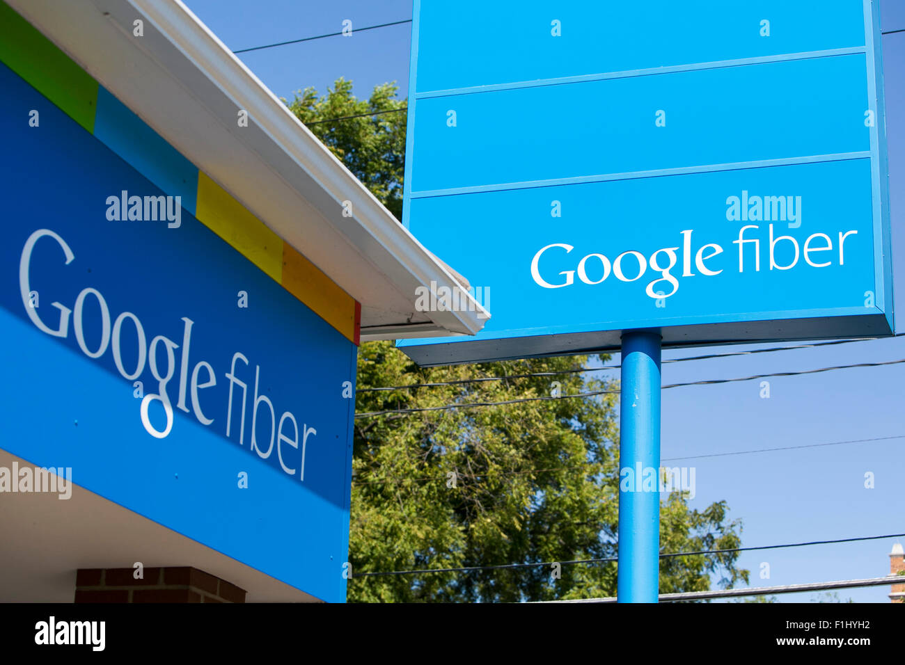 A logo sign outside of a Google Fiber sales office in Kansas City, Missouri on August 23, 2015. Stock Photo